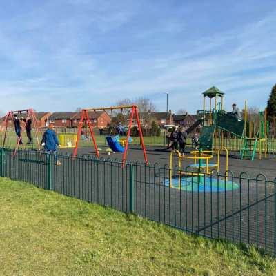 People playing in a child's park